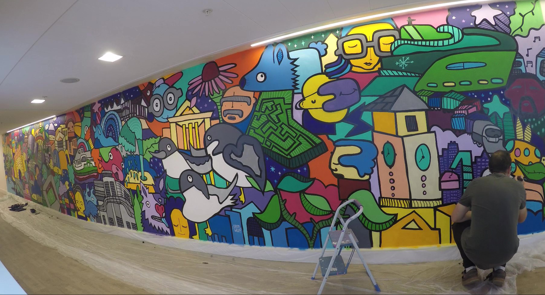 kev munday creating mural